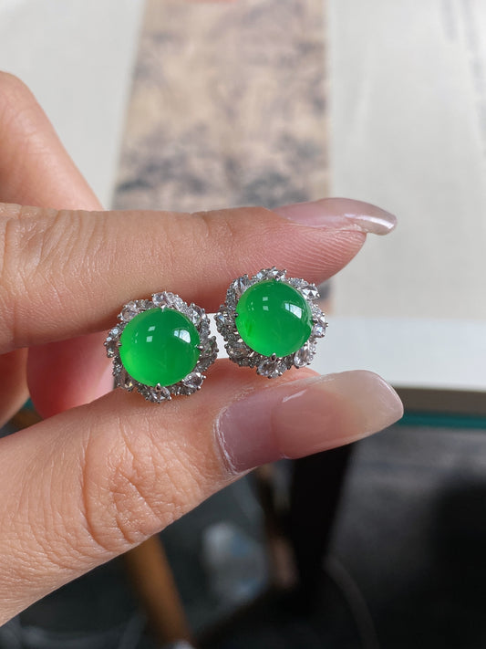 Round green jadeite cabochon stud earrings with halo bezel, silver-tone