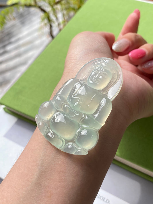 Light green Guanyin jadeite pendant, carved seated figure in clear translucent stone