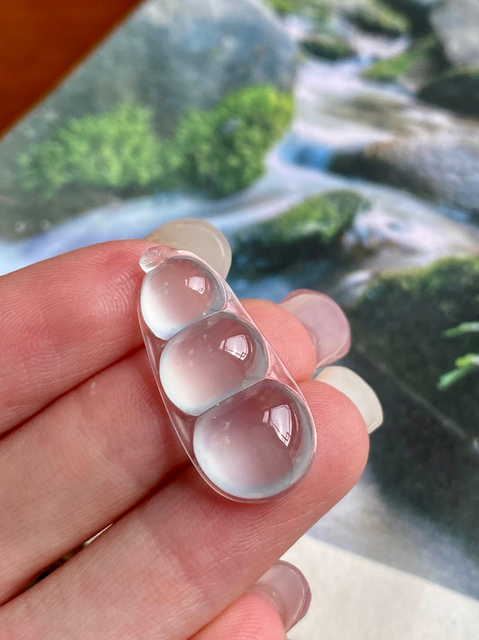 Jadeite bean pendant, three icy-white bean beads with curved silver bezel