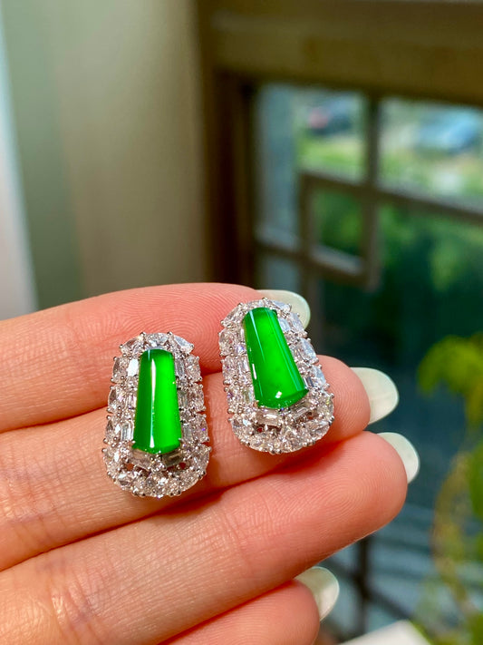 Green jadeite tablet stud earrings with emerald-green centers and sparkling clear-stone halos