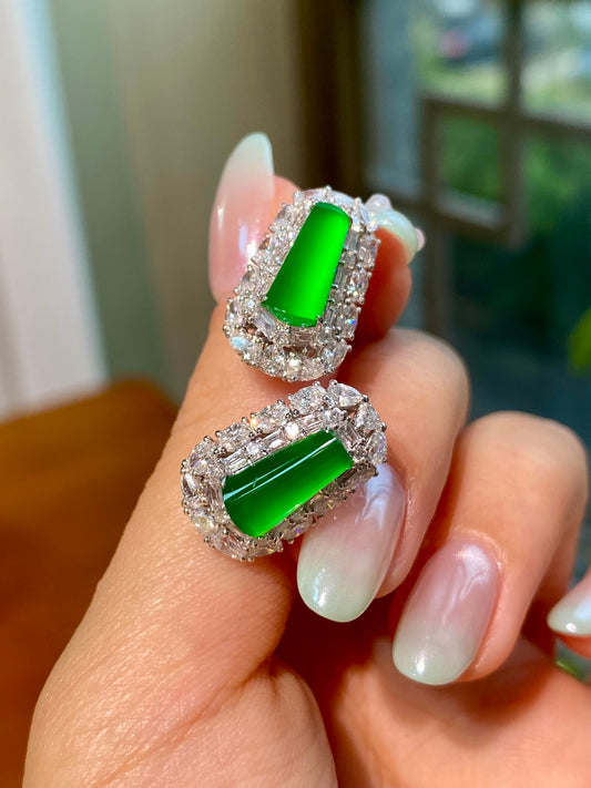 Green jadeite tablet stud earrings, oval halo of clear stones in silver-tone frame