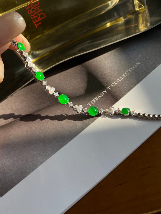 Green jadeite cabochon bracelet with silver-toned links and round green stones