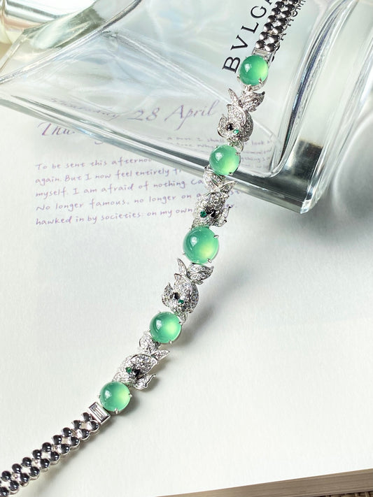 Jadeite cabochon bracelet with green stones and silver floral links