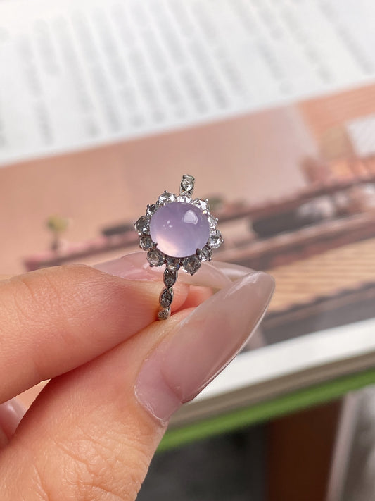 Lavender oval cabochon ring with ornate halo and slender band in silver-tone