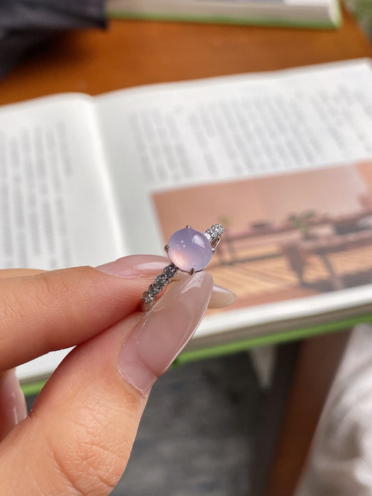 Lavender jadeite cabochon ring with oval stone and pavé band
