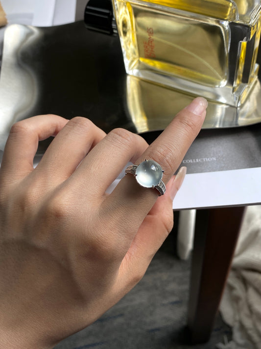White jadeite cabochon ring, round pale stone on dark textured band