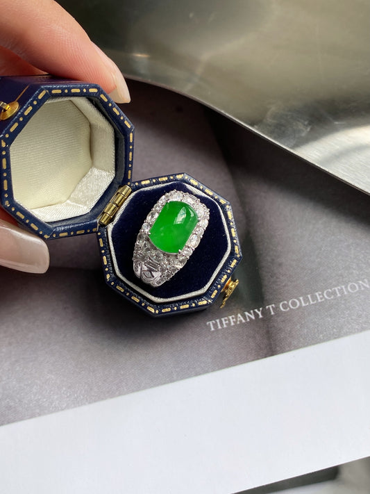 Green jadeite plaque ring in blue ring box, oval green gemstone in pave setting