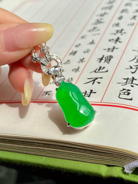 Green jadeite melon pendant necklace with silver-toned setting and rhinestone links