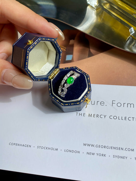 Stackable ring set with green jade cabochons in blue decorative bezels