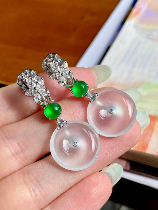 Silver drop earrings: white donut discs, green beads, baguette crystal accents