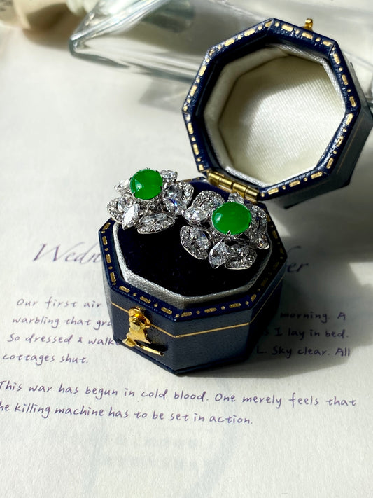 Green jade cabochon stud earrings with clear crystal cluster shown in blue jewelry box
