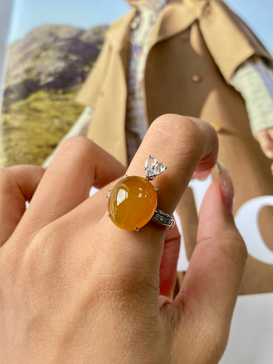 Amber cabochon ring with clear stones in silver setting; pendant in navy blue case