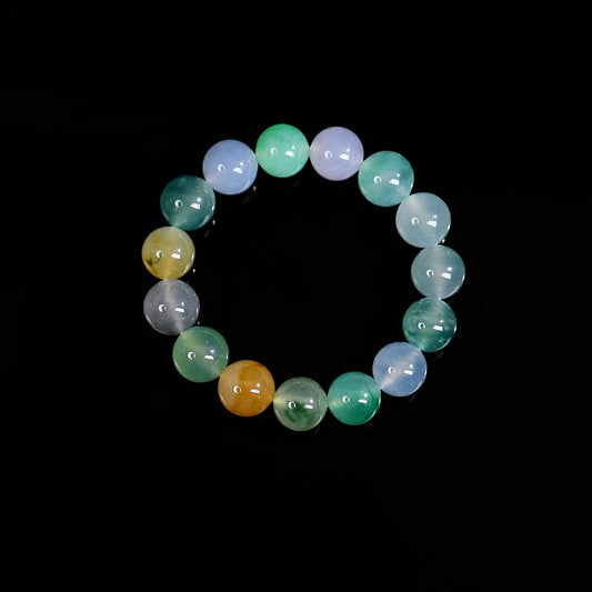 Multi-color jadeite beaded bracelet with round beads in green, light blue, lavender, gray, and gold