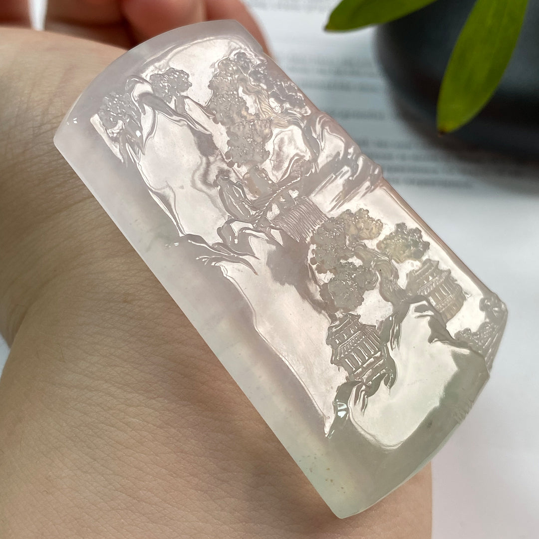 Jadeite landscape pendant with raised village and tree pattern on translucent light stone