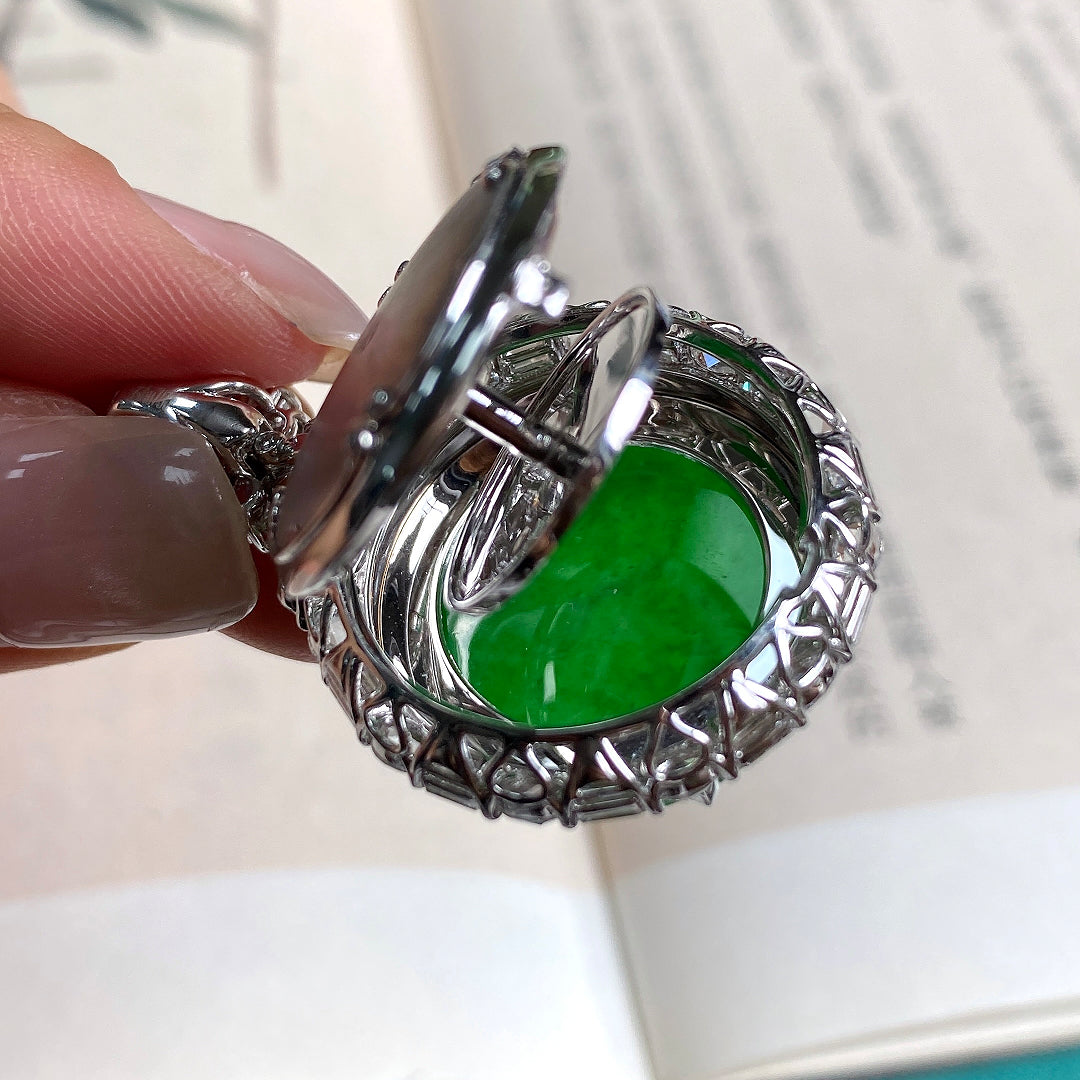Green jadeite tablet pendant with silver prong-set halo and ornate bezel frame