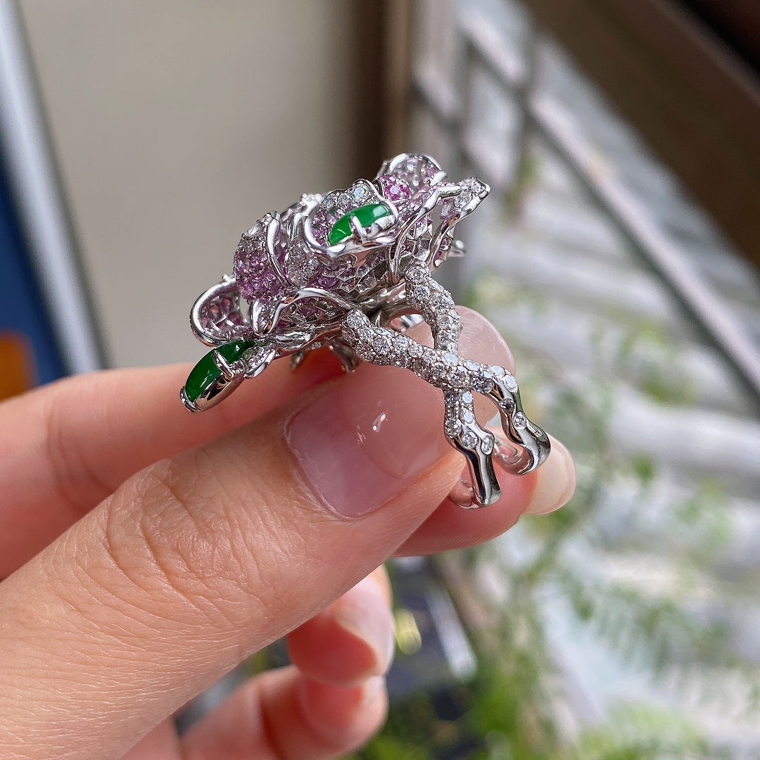 Silver-tone camellia ring with green cabochon stones and pavé accents