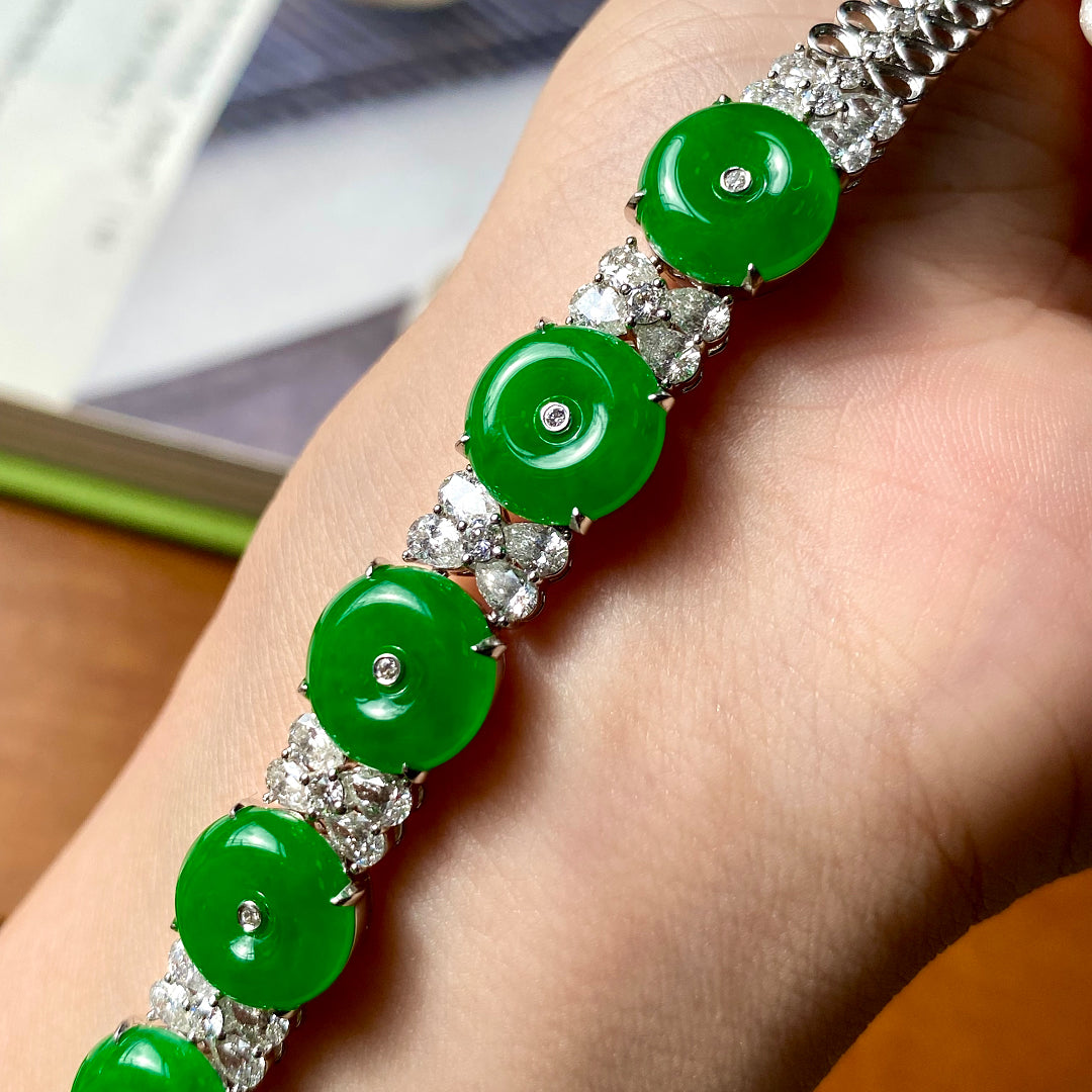 Green jadeite donut bracelet with round silver links and clear diamond-like spacers