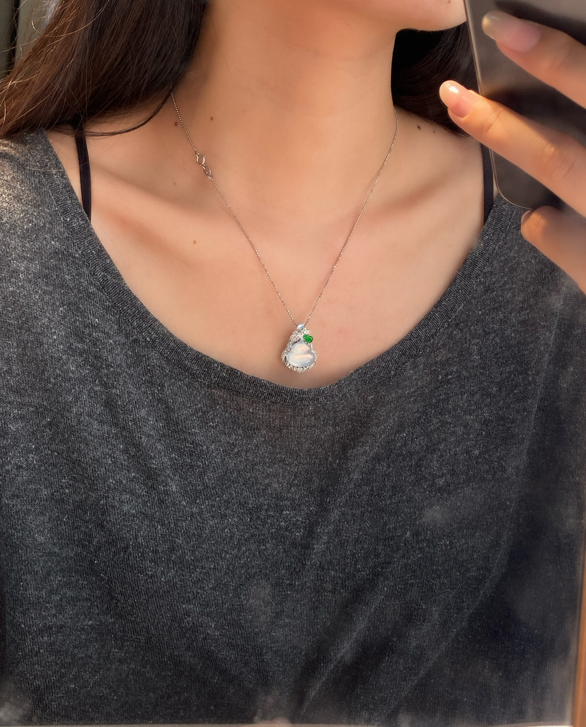 Icy white jadeite gourd pendant with green accents and crystal halo, silver-tone