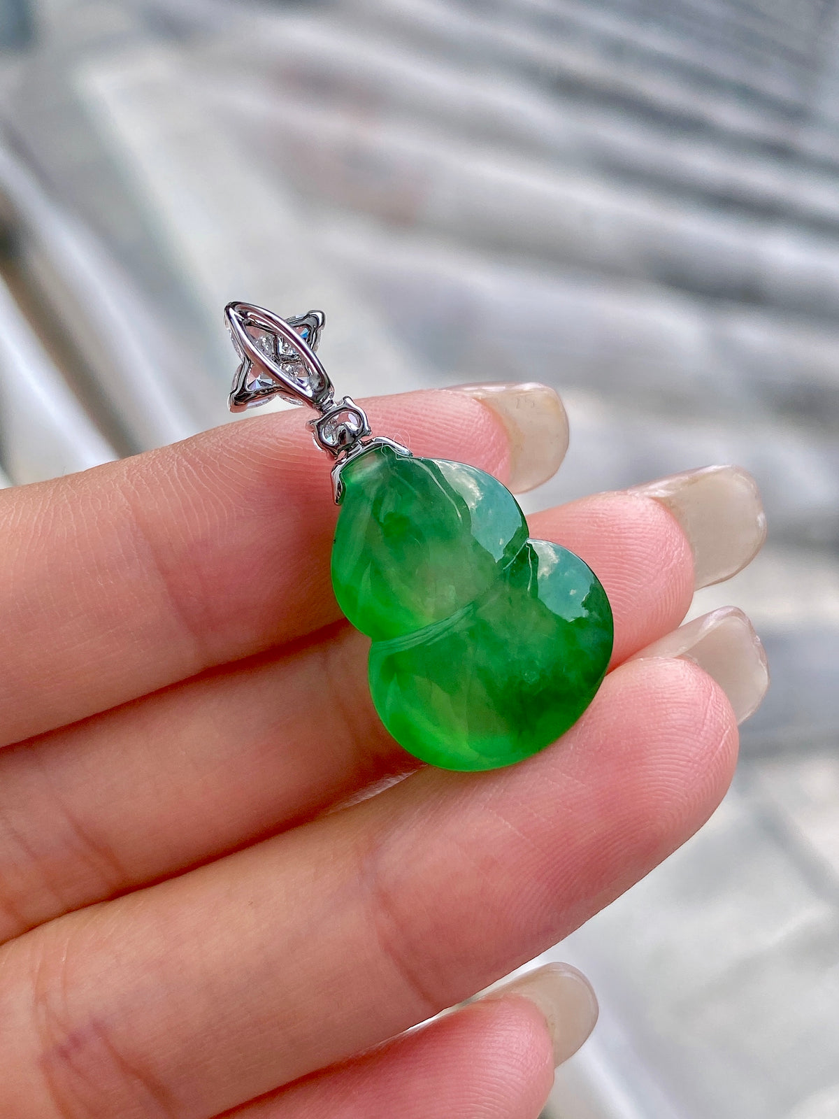 Green jadeite gourd pendant with silver marquise setting and diamond-like stones