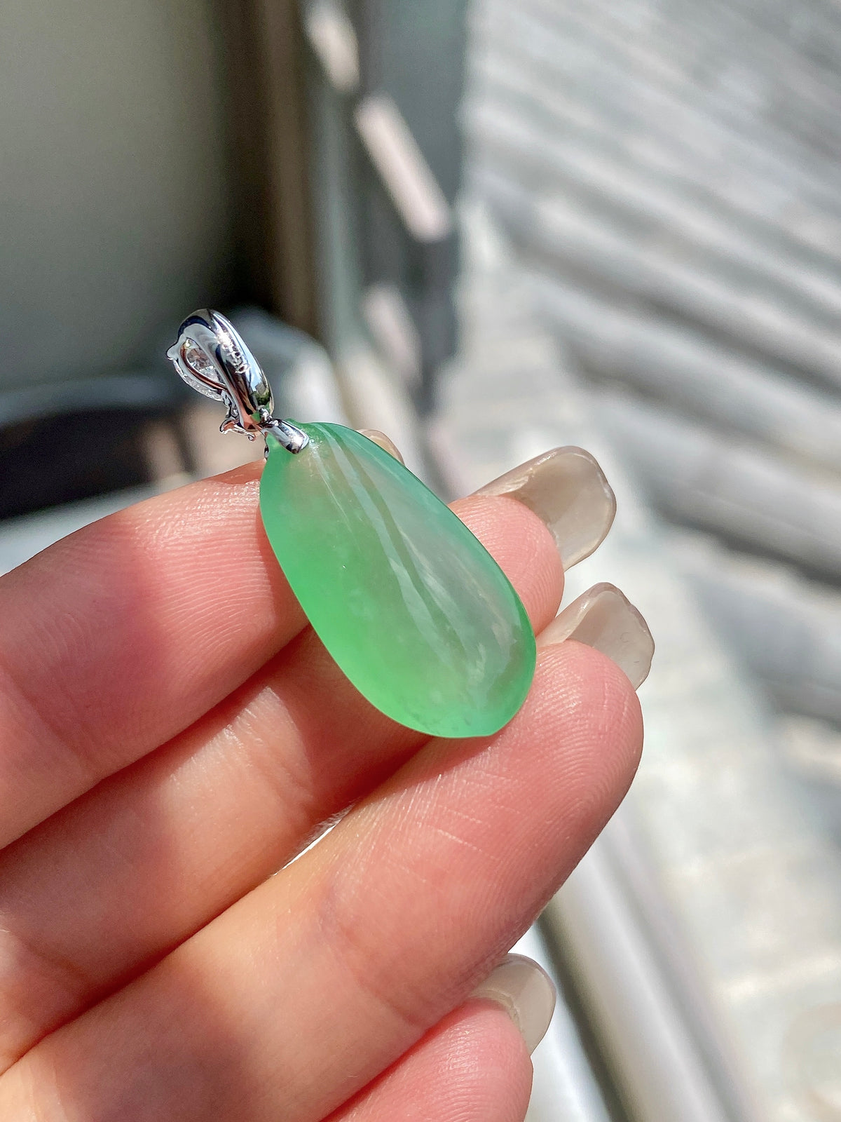Apple green jadeite melon pendant with silver bail