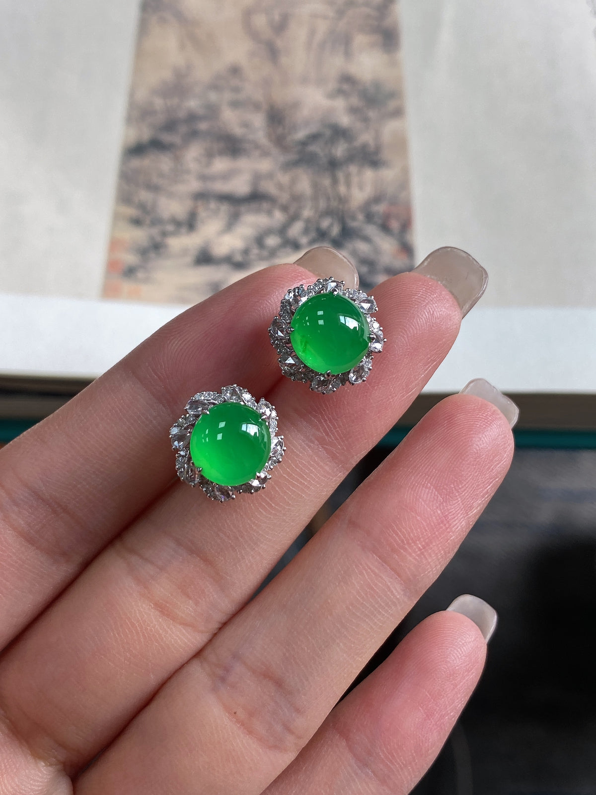Green jadeite cabochon stud earrings with round halo settings, silver-tone