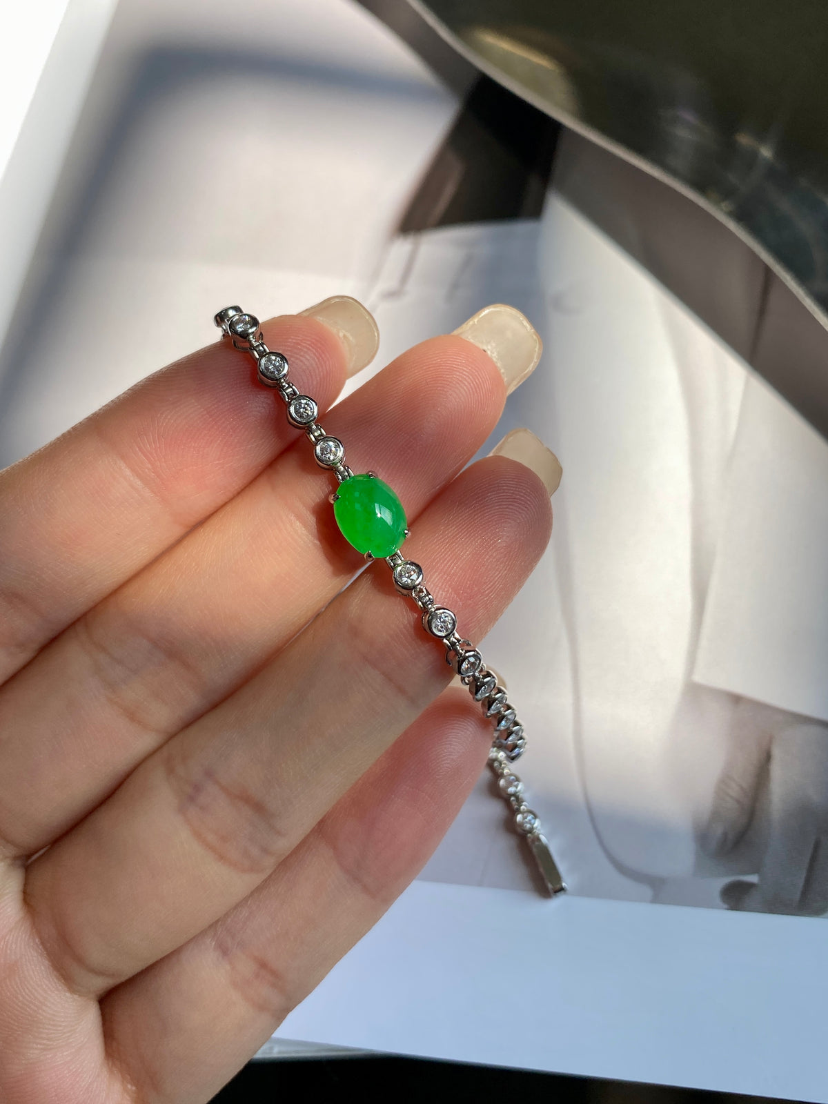 Green jadeite cabochon bracelet with silver-tone beaded links and clasp end