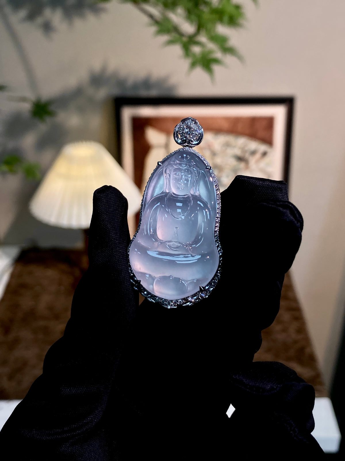 Jadeite Guanyin pendant with translucent light blue Guanyin relief, jeweled silver cap
