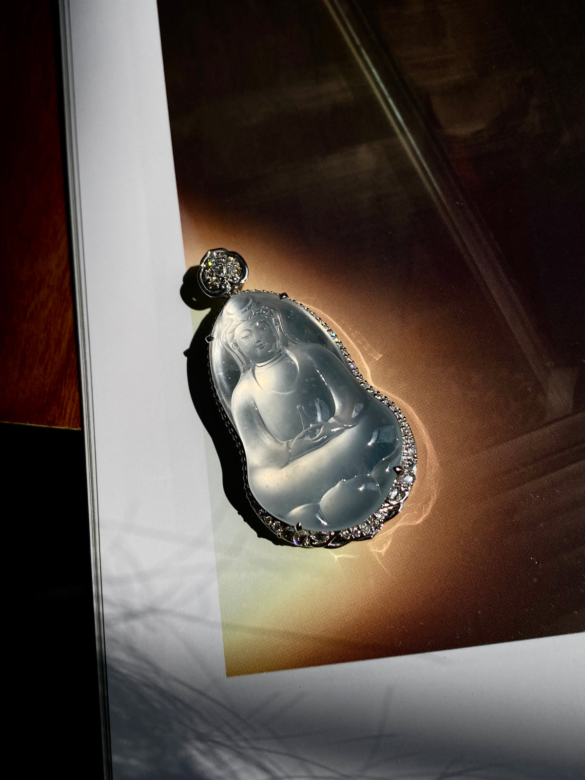 Jadeite Guanyin pendant teardrop with icy blue carving and rhinestone border, round bail stone