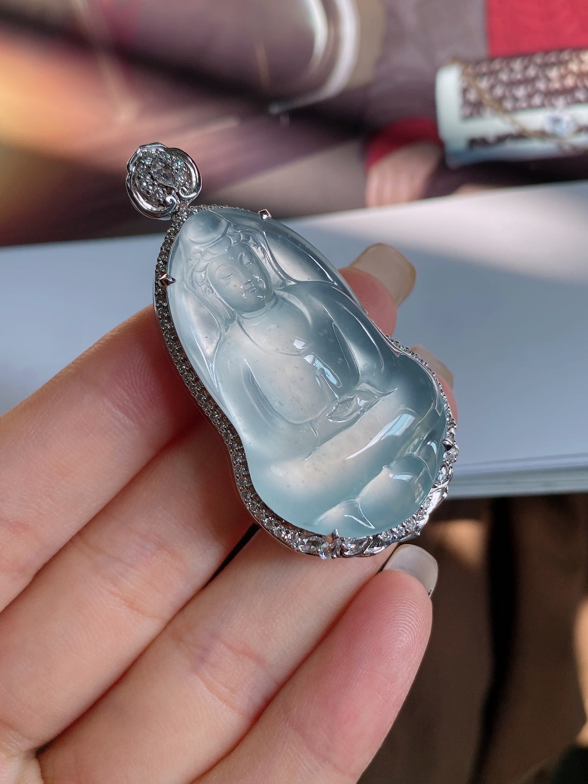 Jadeite Guanyin pendant teardrop with icy blue relief, diamond-like border and round top stone