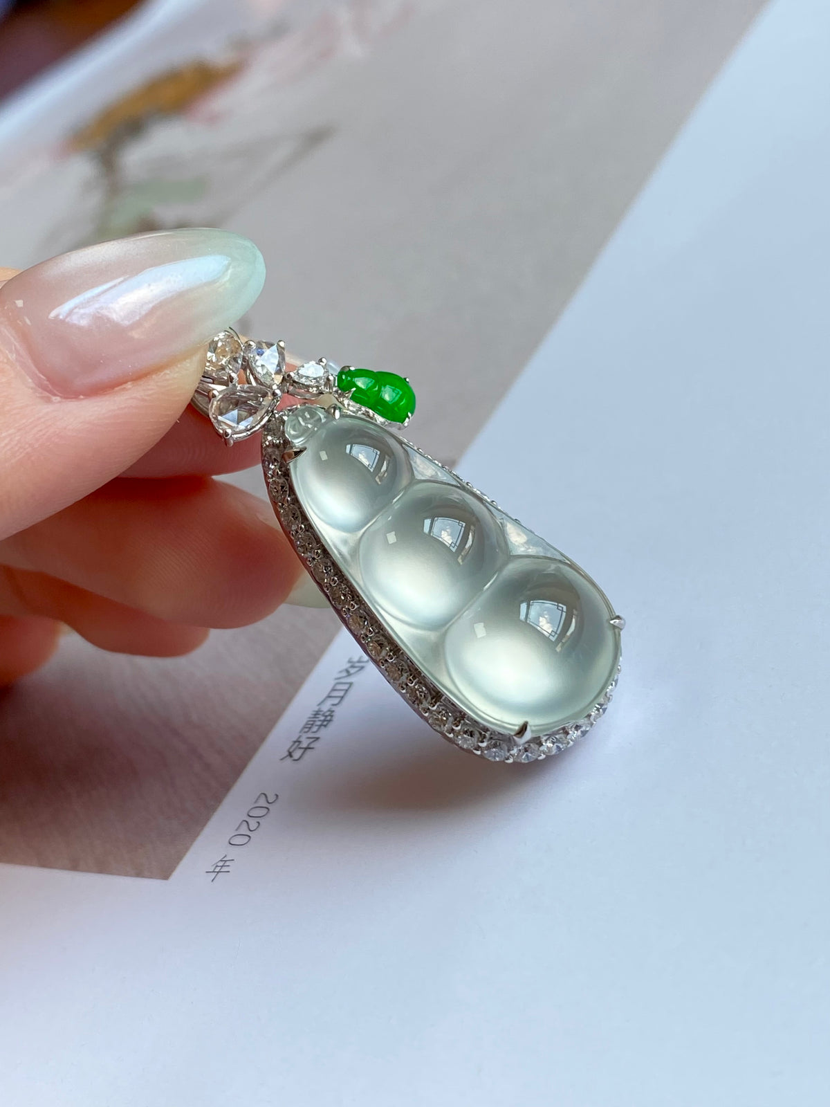 Pea pod jade pendant with milky oval stones, green top accent, and crystal cluster