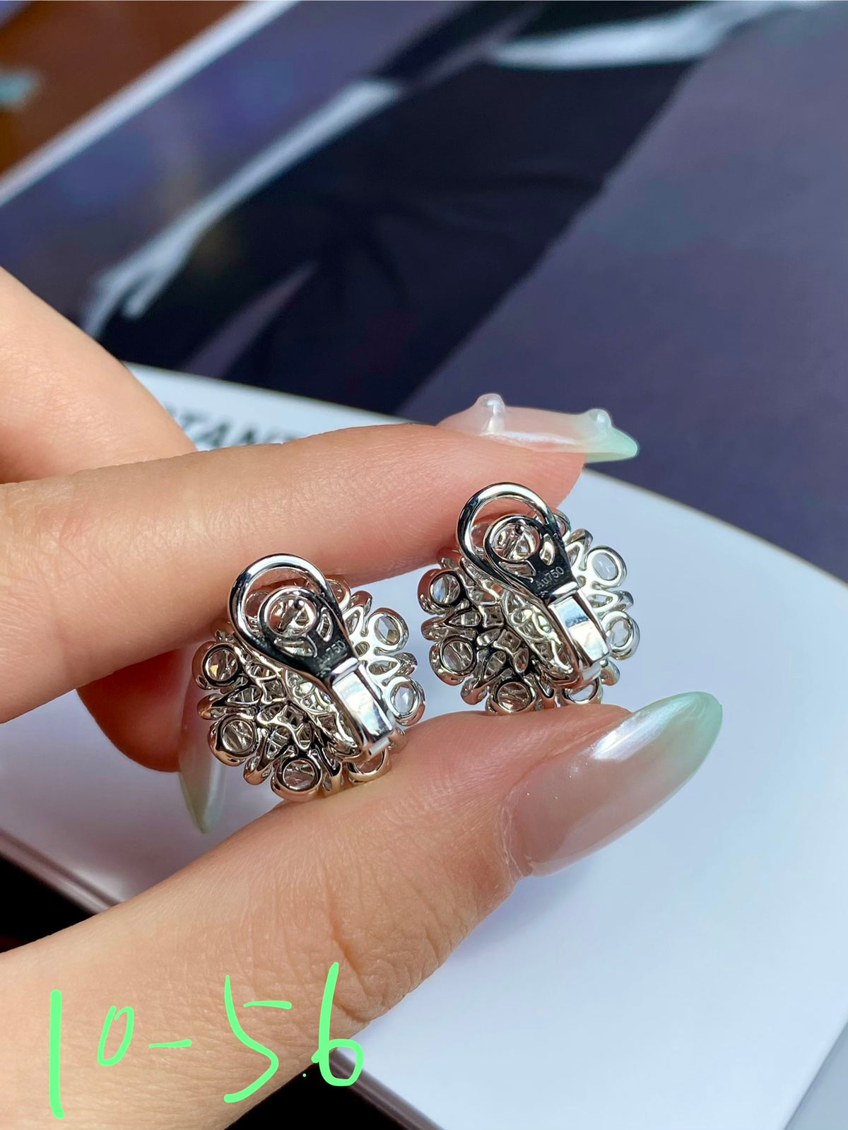 Silver-tone filigree stud earrings with circular rhinestone frame