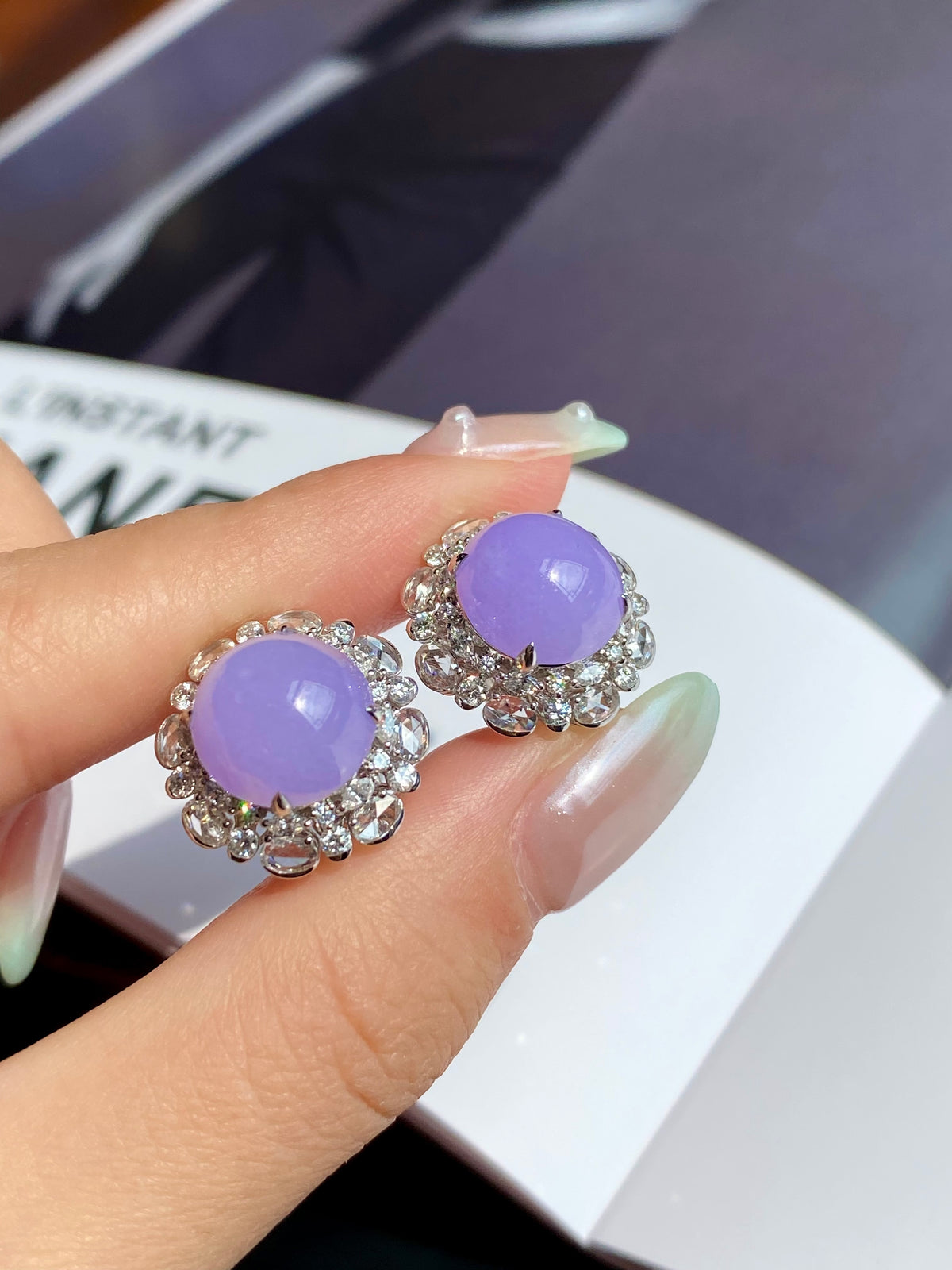 Lavender cabochon stud earrings with halo of rhinestones, silver-tone setting