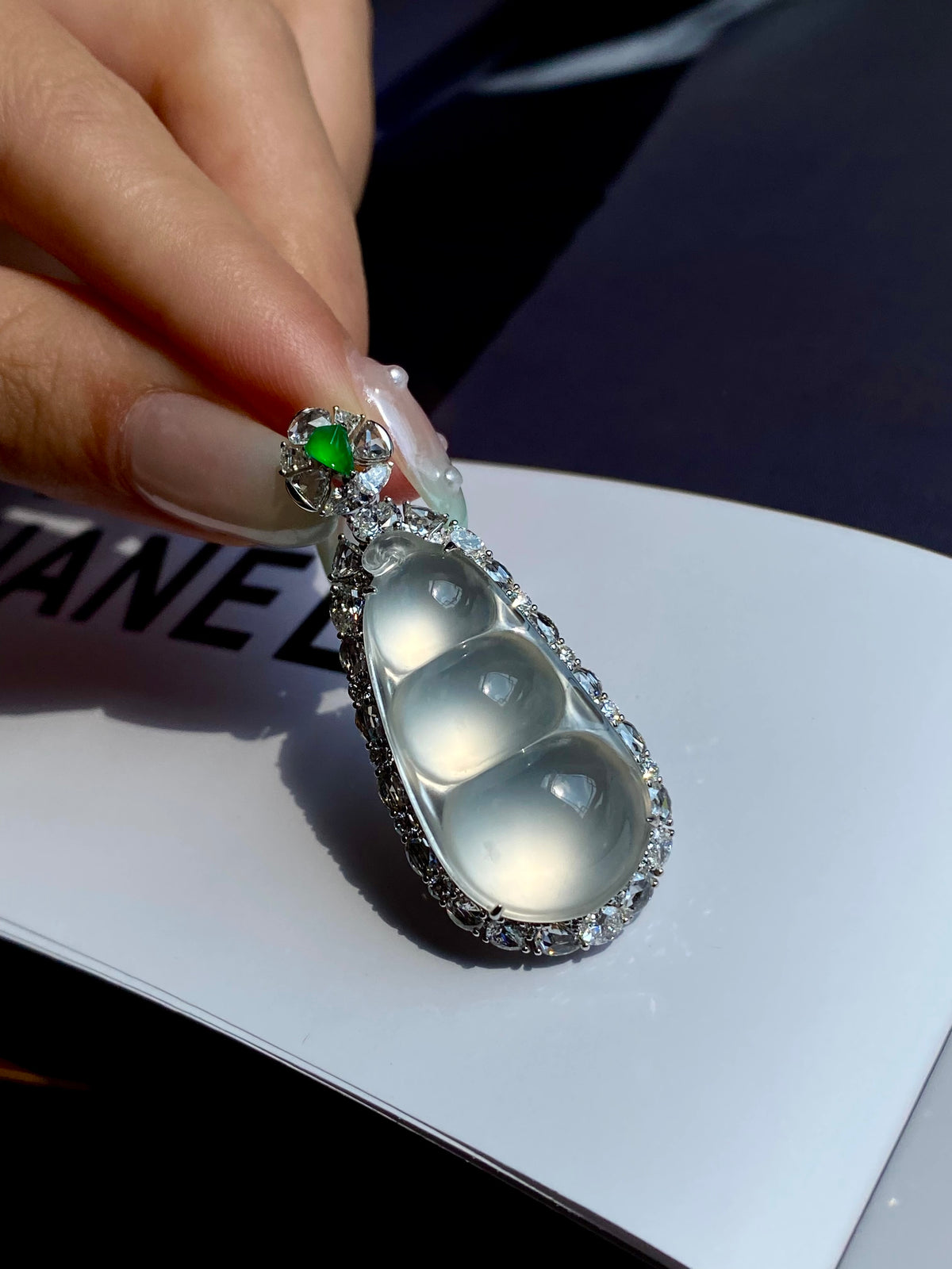 Jadeite pea pod pendant with green top stone, icy cabochon pods in ornate silver setting