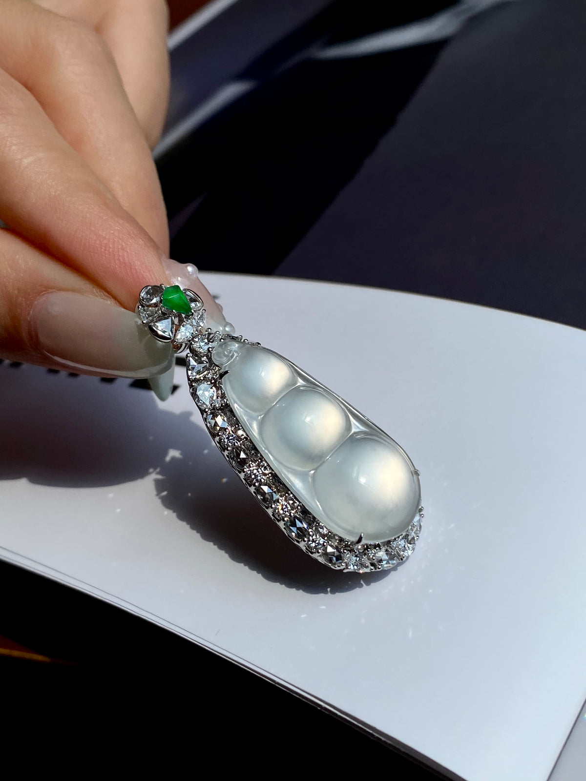 Jadeite pea pod pendant with green top stone and icy teardrop centers, silver filigree