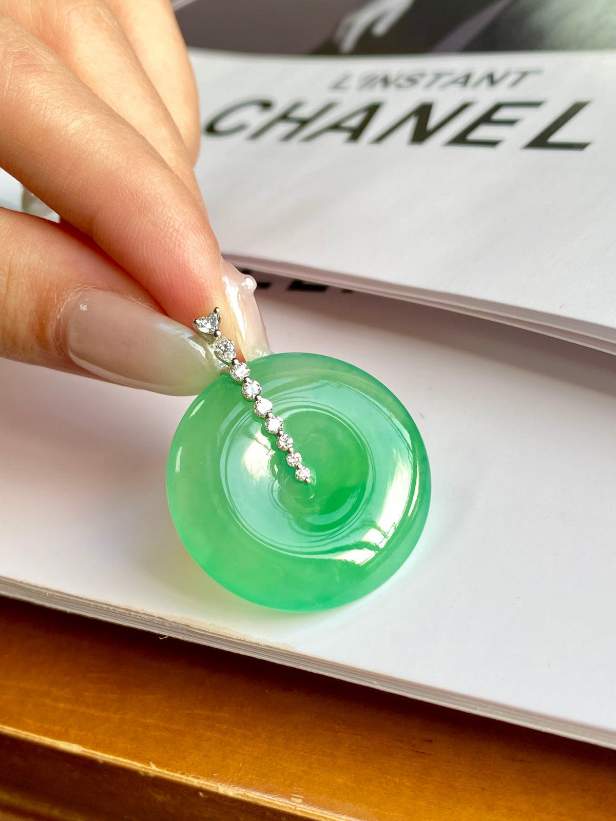 Green jadeite donut pendant on a rhinestone chain