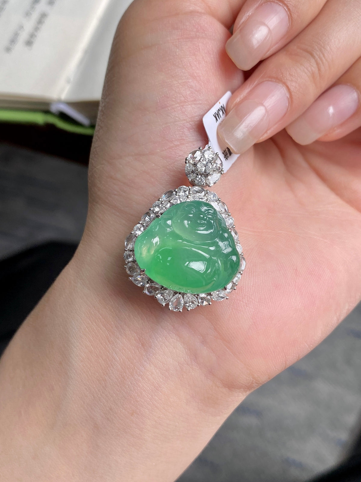 Green jadeite Buddha pendant, teardrop face with diamond-like halo in silver