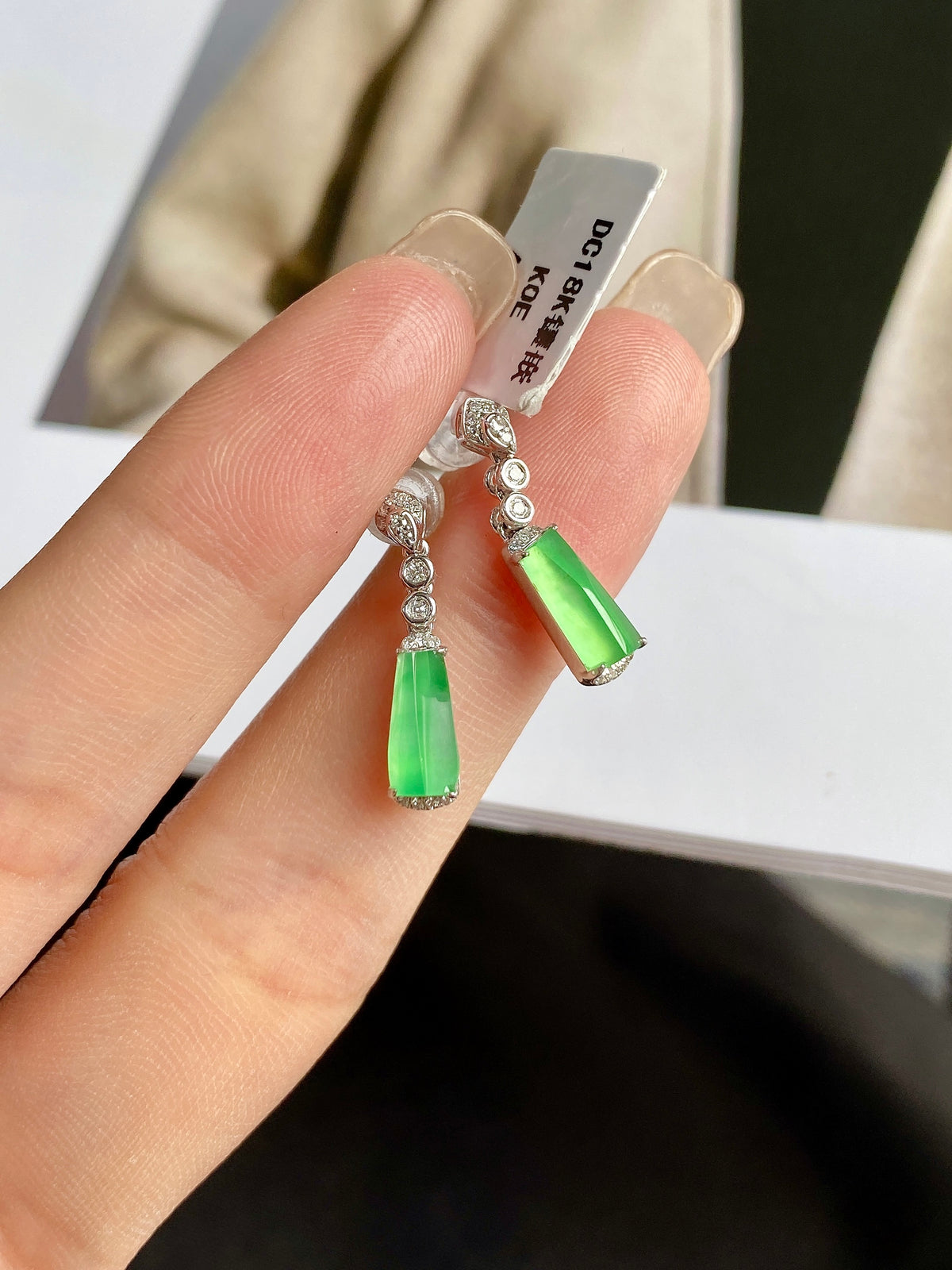 Apple-green jade drop earrings on silver hooks with sparkling round accents