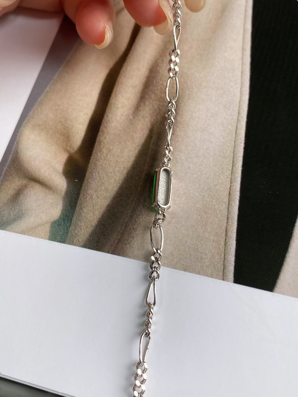 Silver chain necklace with green jadeite free-form pendant and oval links