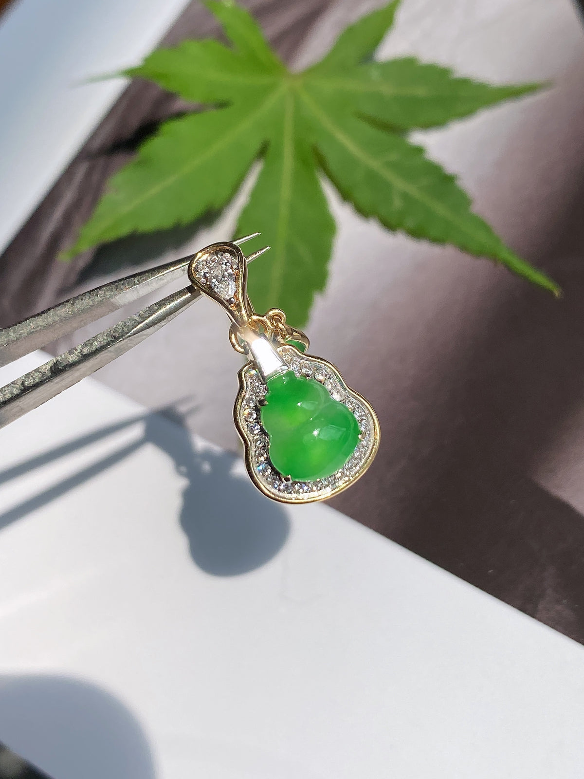 Gold-tone jadeite gourd pendant with bright green teardrop jade and crystal halo