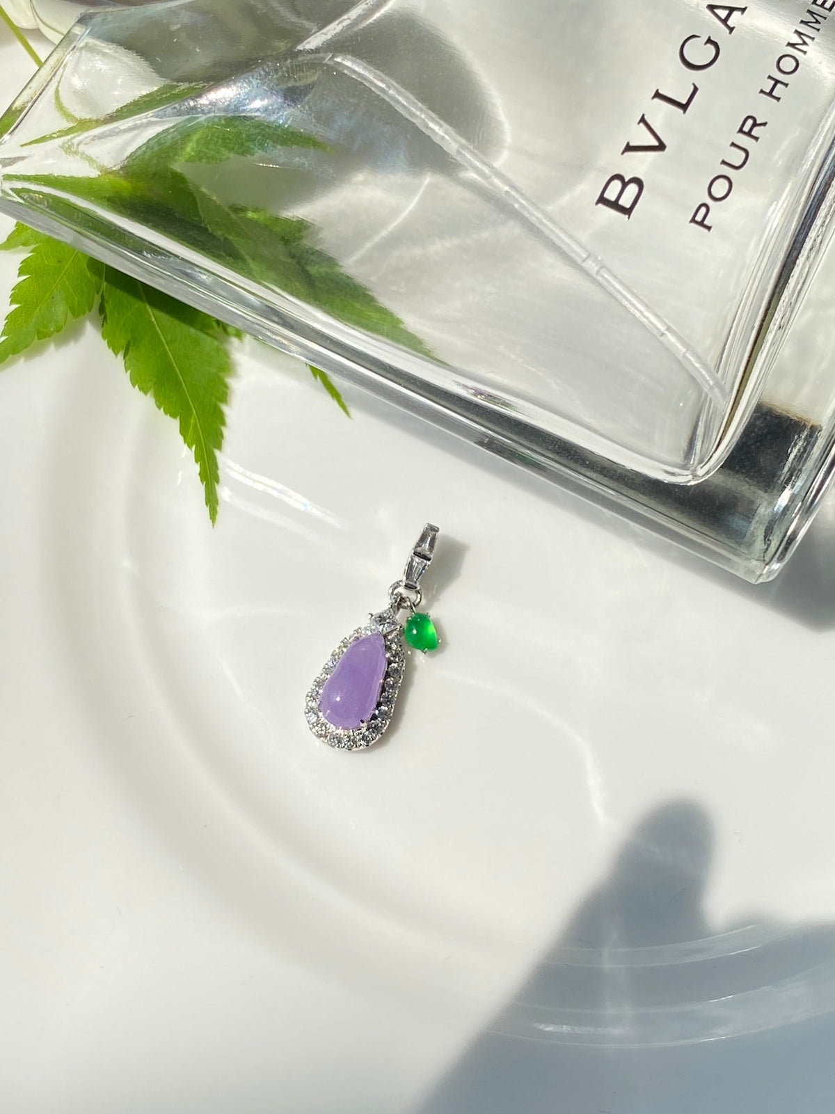Lavender jade bean pendant with green teardrop accent, silver-tone halo border