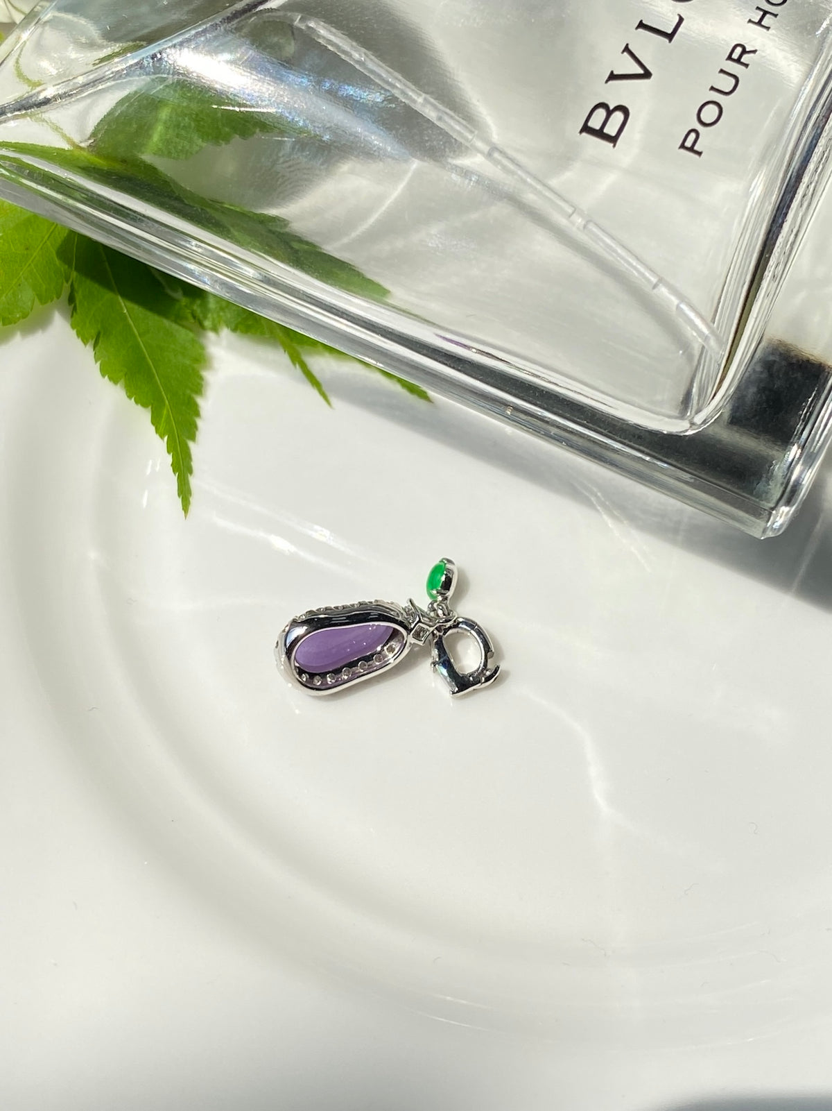 Lavender teardrop pendant with silver border, green stone charm, small loop bail