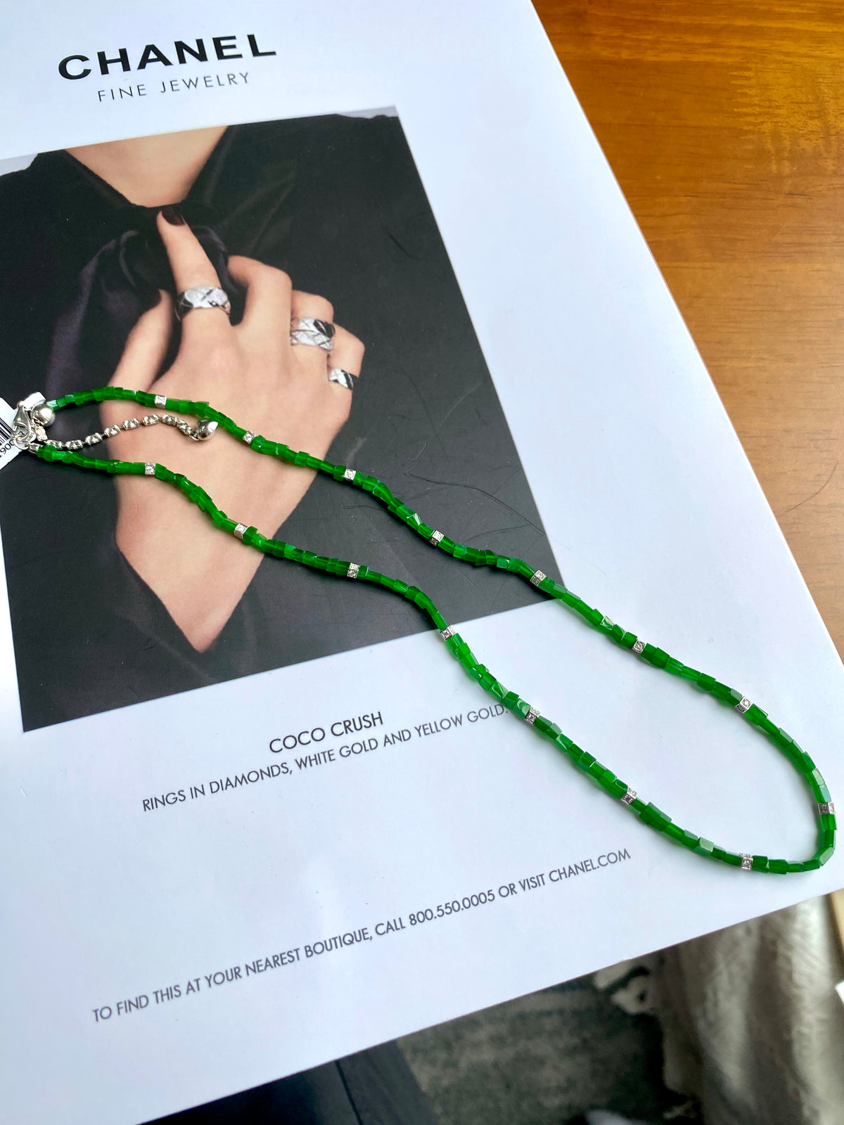 Long green jadeite beaded necklace with silver spacer links and chain-like beads