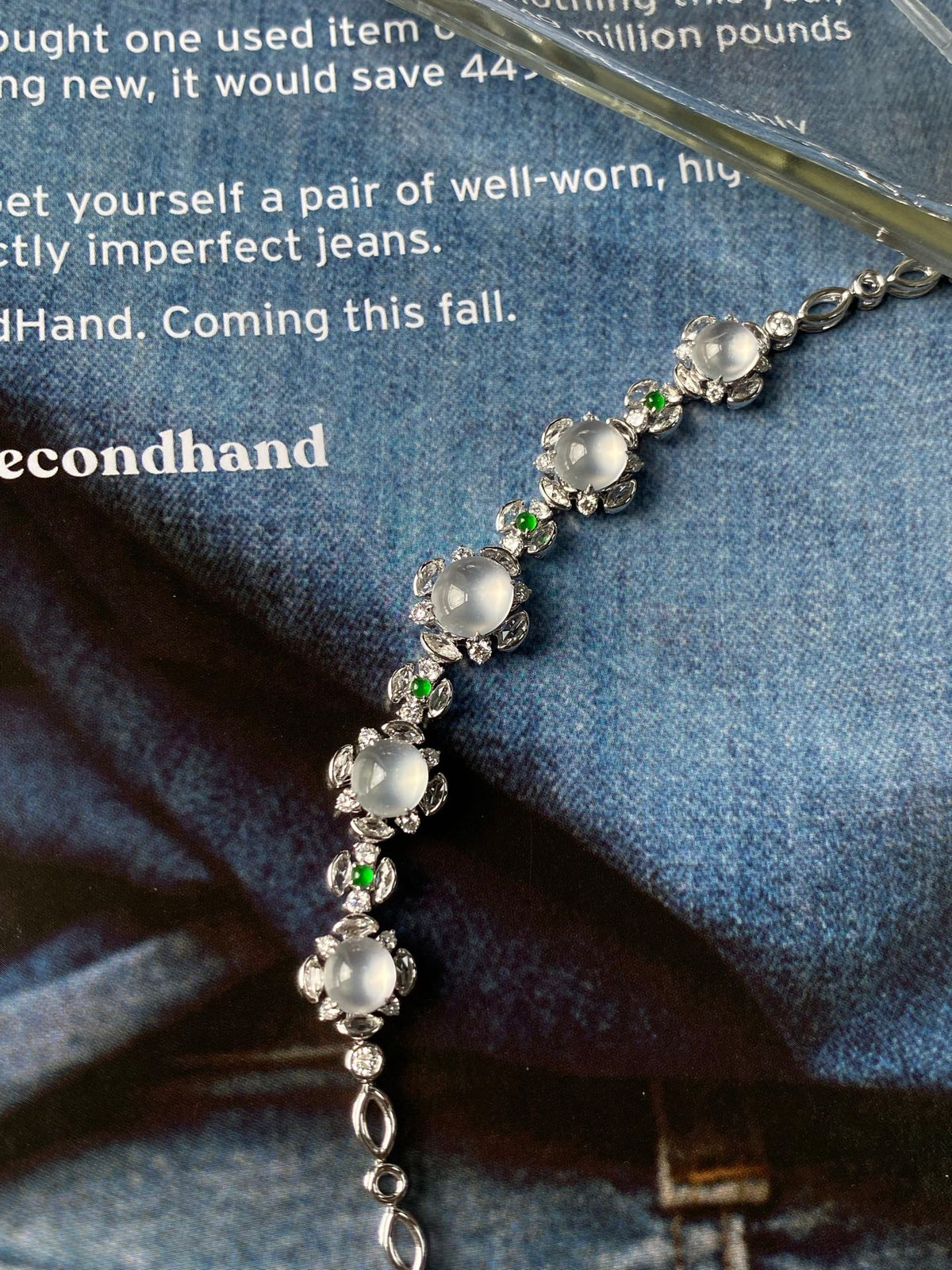 Silver-tone icy white cabochon bracelet with green gem accents and oval stones
