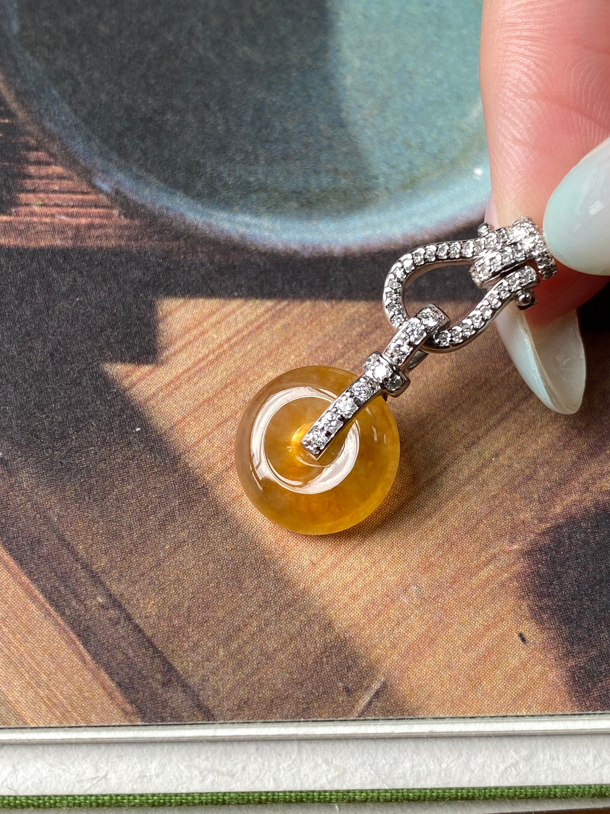 Golden-yellow jadeite donut pendant necklace with silver rhinestone clasp