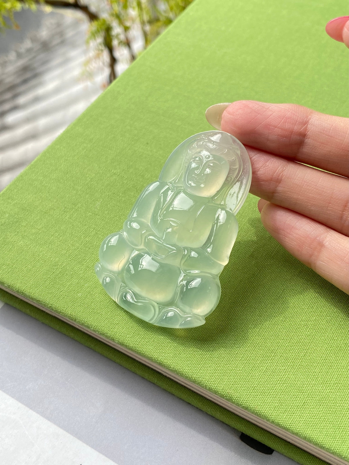 Light green jadeite Guanyin pendant, translucent carved figure on open setting