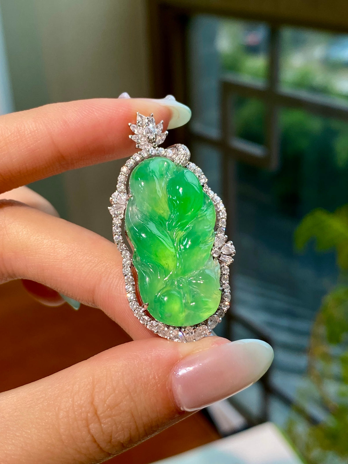 Green jadeite leaf pendant with bright leaf carving, silver-tone prong setting