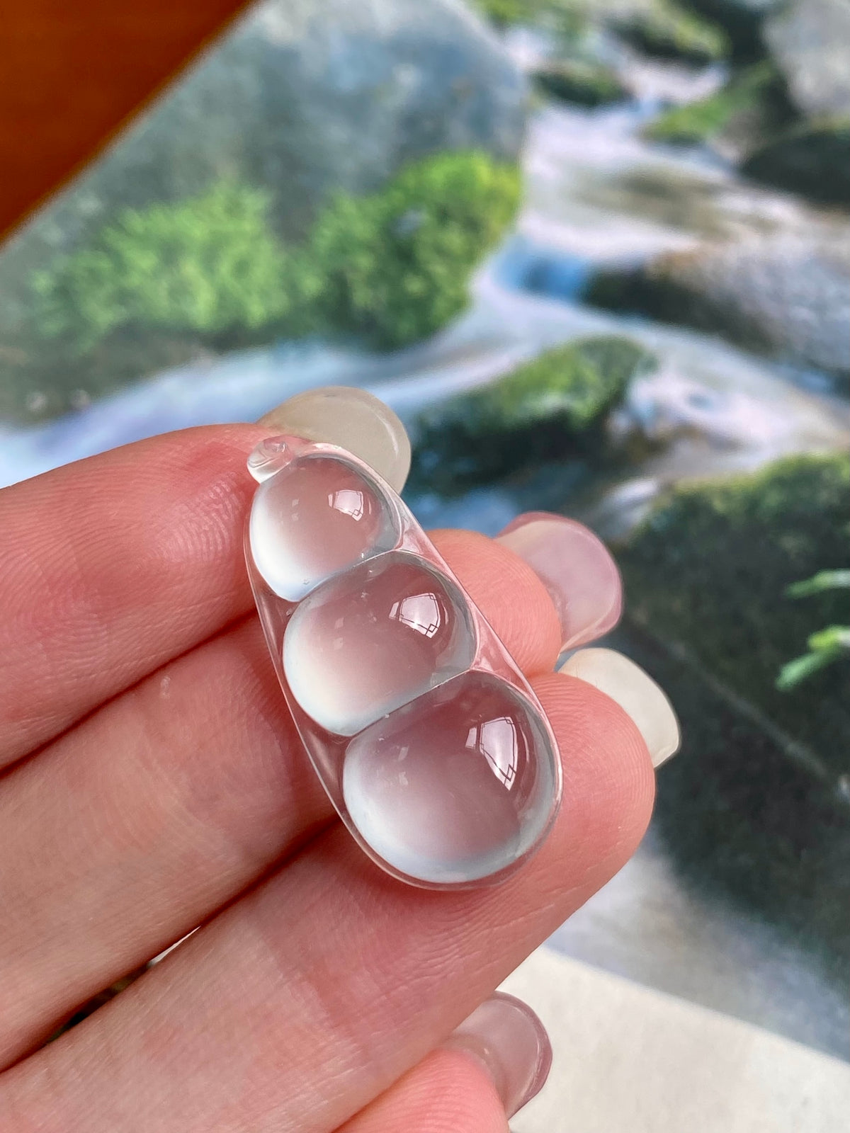 Jadeite bean pendant, three icy-white bean beads with curved silver bezel
