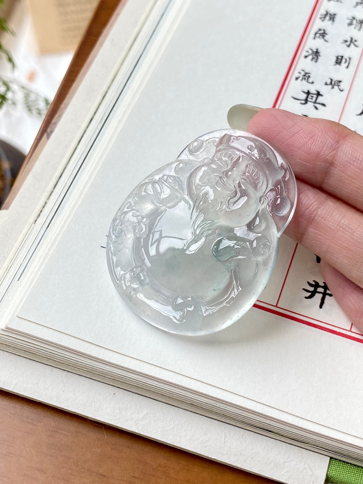 Jadeite money god pendant, oval carved relief with glossy icy white finish