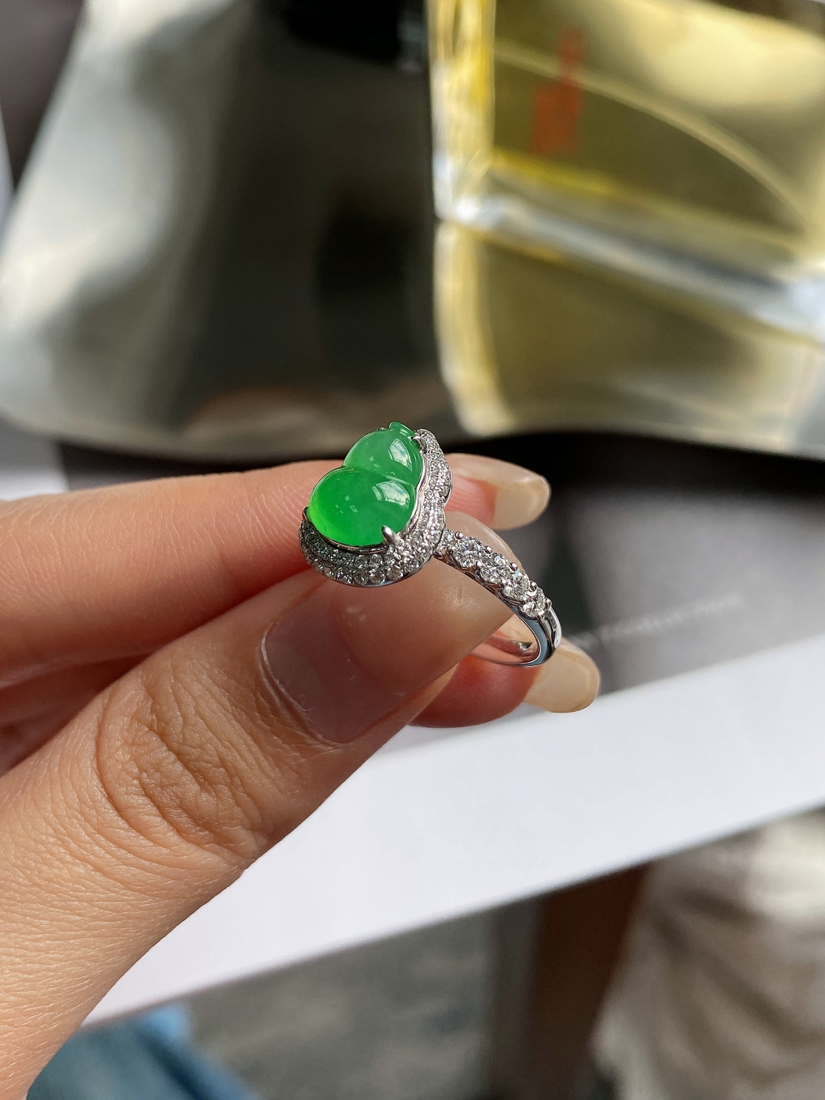 Vibrant green jadeite gourd ring with silver pavé band
