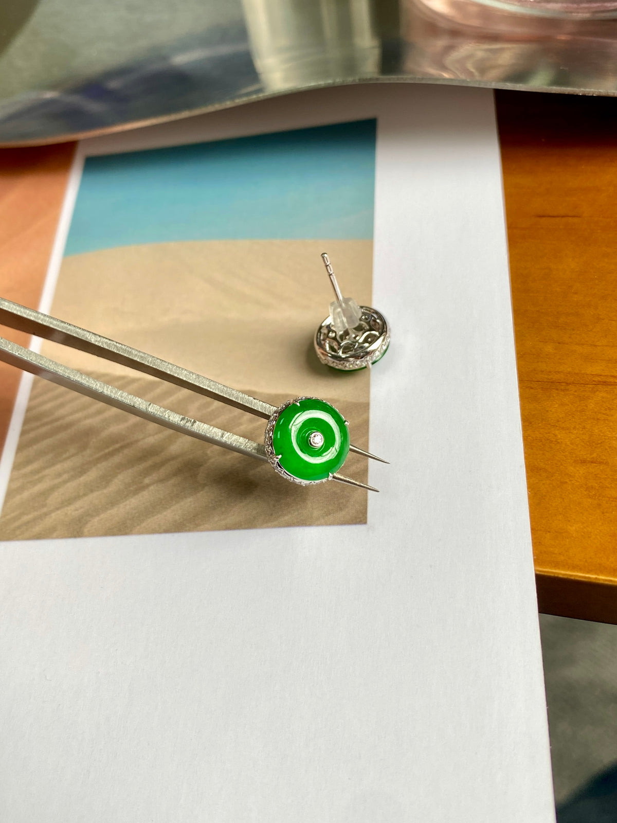 Green jadeite donut stud earrings with silver-tone round discs and post backs.